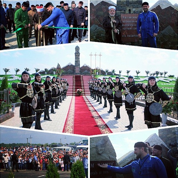 памятник женщины на фоне башни